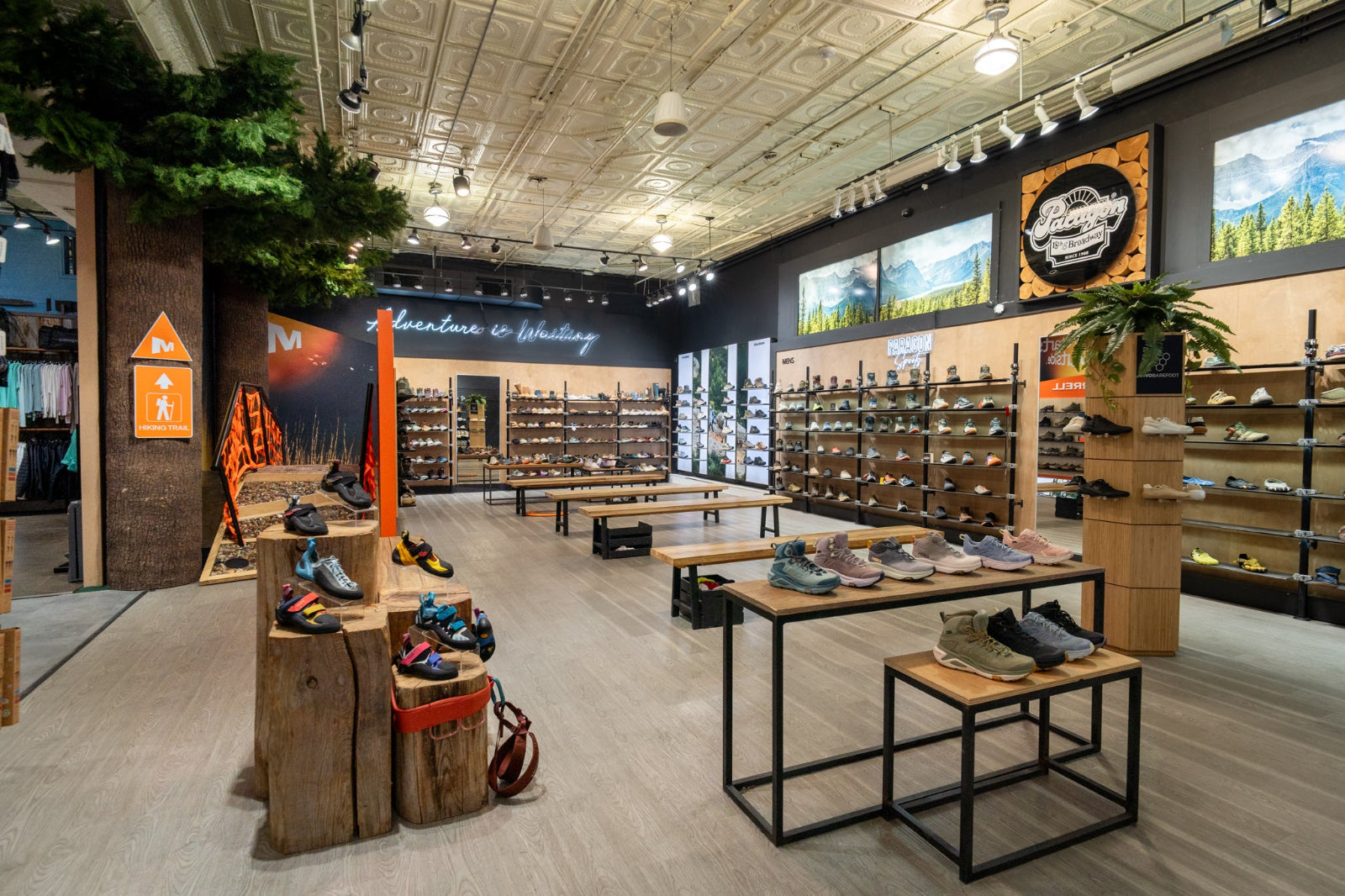 Paragon Sports Store interior with shoe displays and promotional signs on the walls.